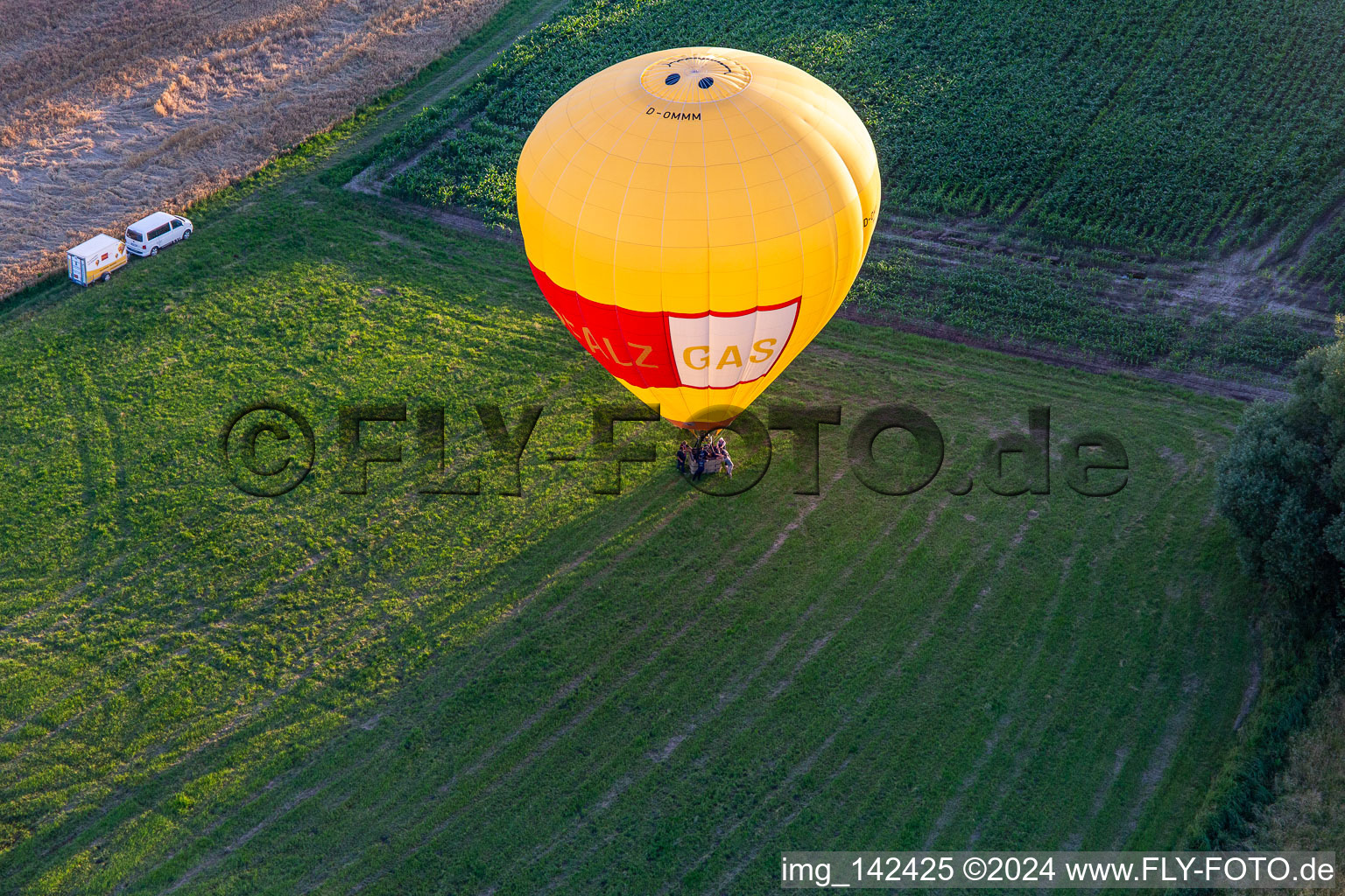 Landing of two hot air balloons "Pfalzgas in Winden in the state Rhineland-Palatinate, Germany seen from above