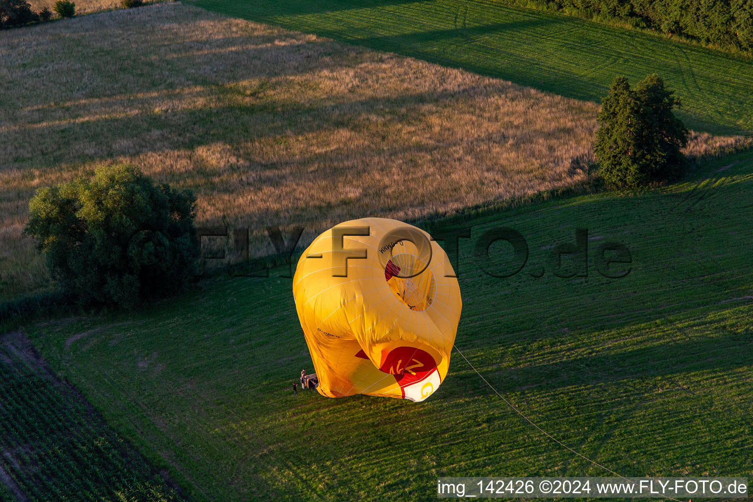 Landing of two hot air balloons "Pfalzgas in Winden in the state Rhineland-Palatinate, Germany from the plane