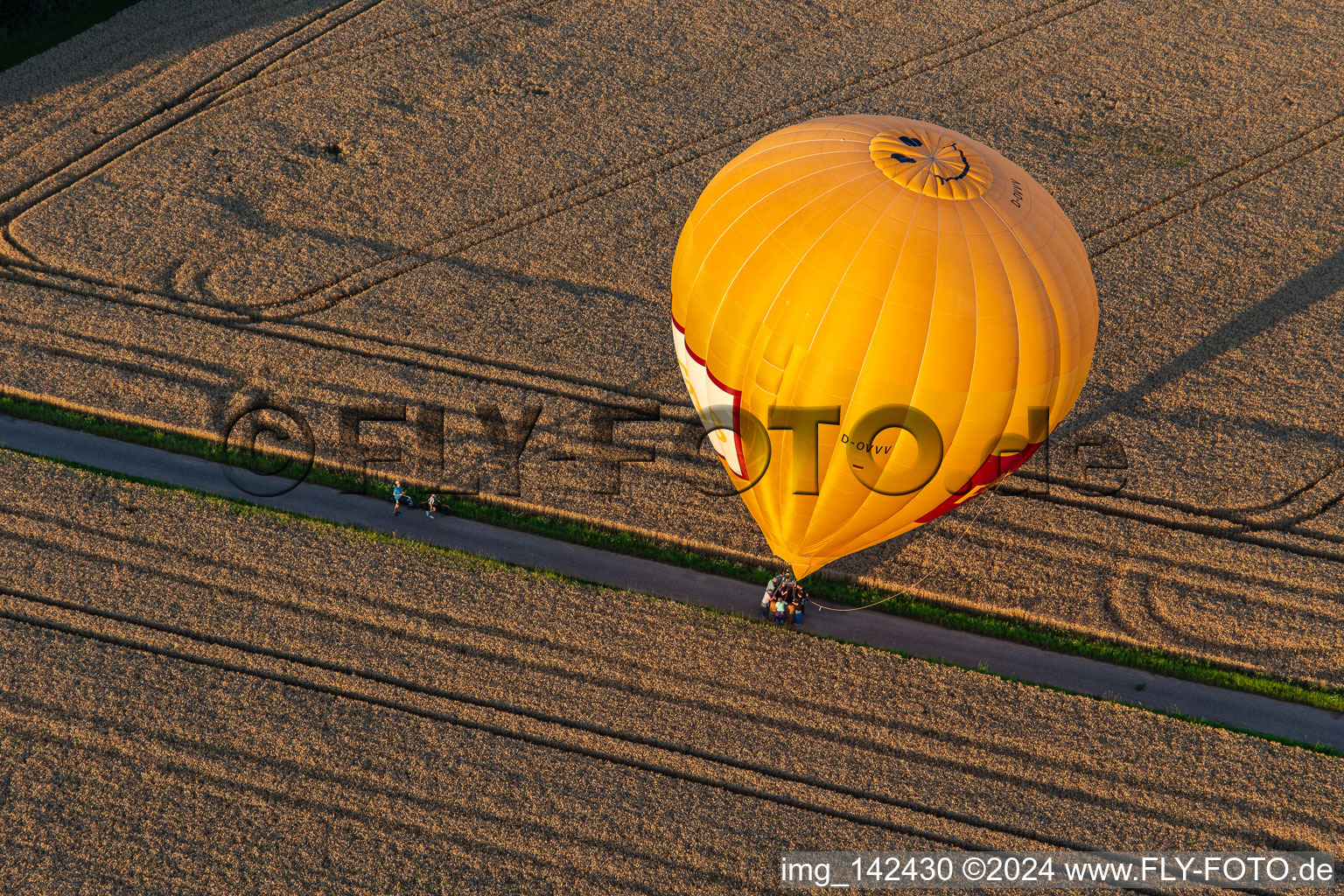 Bird's eye view of Landing of two hot air balloons "Pfalzgas in Winden in the state Rhineland-Palatinate, Germany