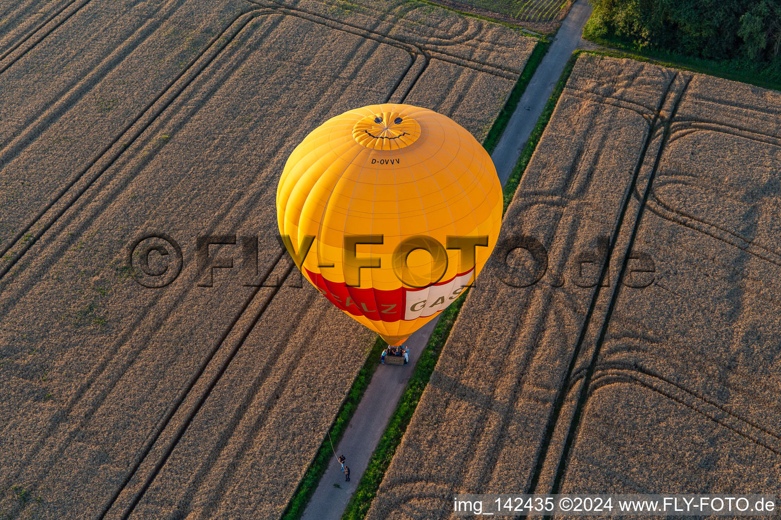 Landing of two hot air balloons "Pfalzgas in Winden in the state Rhineland-Palatinate, Germany viewn from the air