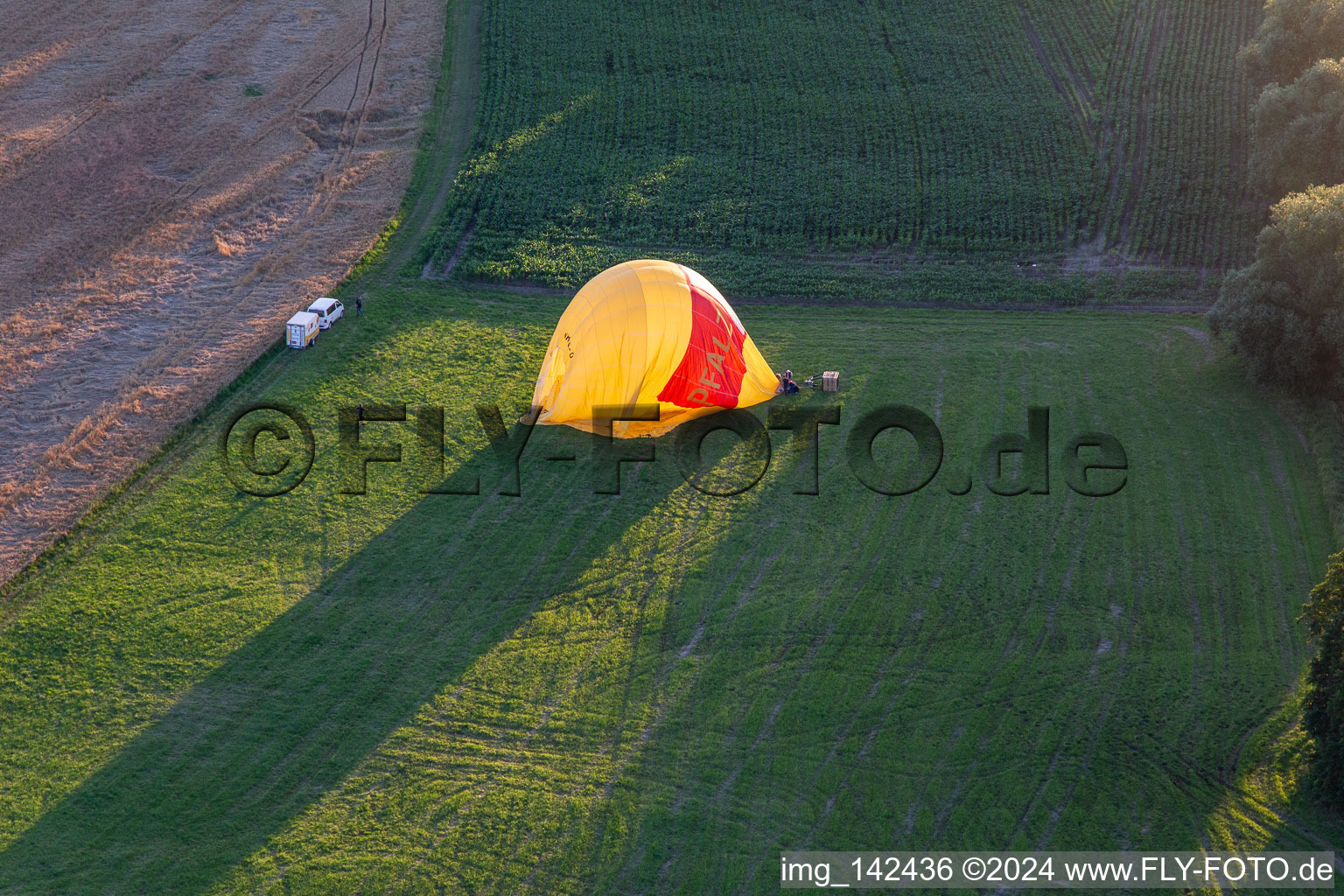 Drone recording of Landing of two hot air balloons "Pfalzgas in Winden in the state Rhineland-Palatinate, Germany