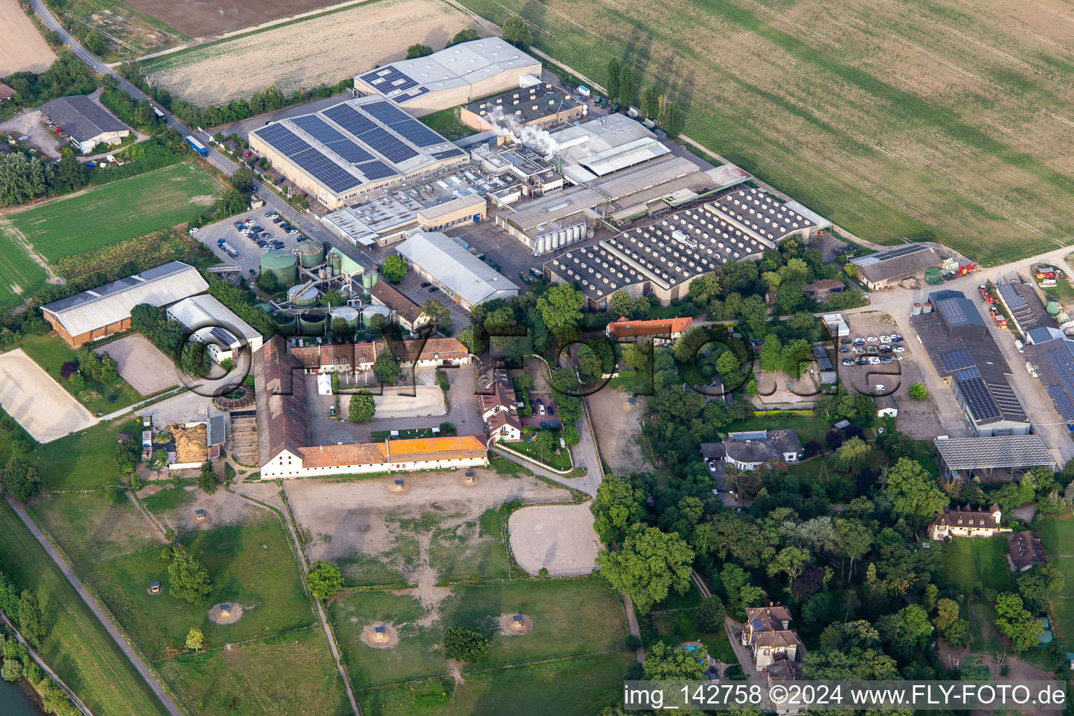 Aerial view of Intersnack Deutschland SE Petersau plant and Carlo von Opel riding facility in the district Mörsch in Frankenthal in the state Rhineland-Palatinate, Germany