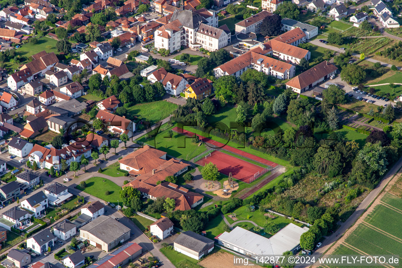 Oblique view of St. Paulus Stift Herxheim in Herxheim bei Landau in the state Rhineland-Palatinate, Germany