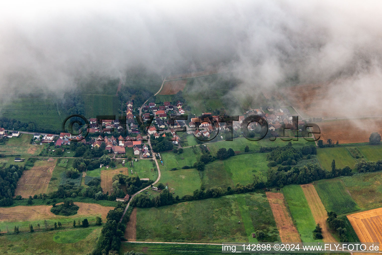 Village from the north under low clouds in Hergersweiler in the state Rhineland-Palatinate, Germany