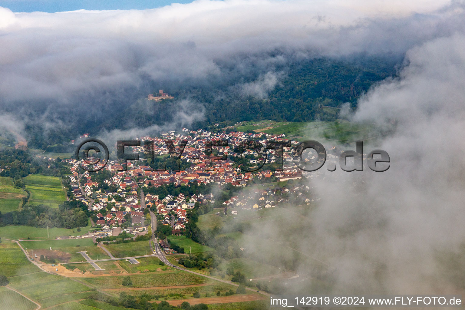 Village on the edge of the Pfläzerwald from the northeast under clouds in Klingenmünster in the state Rhineland-Palatinate, Germany