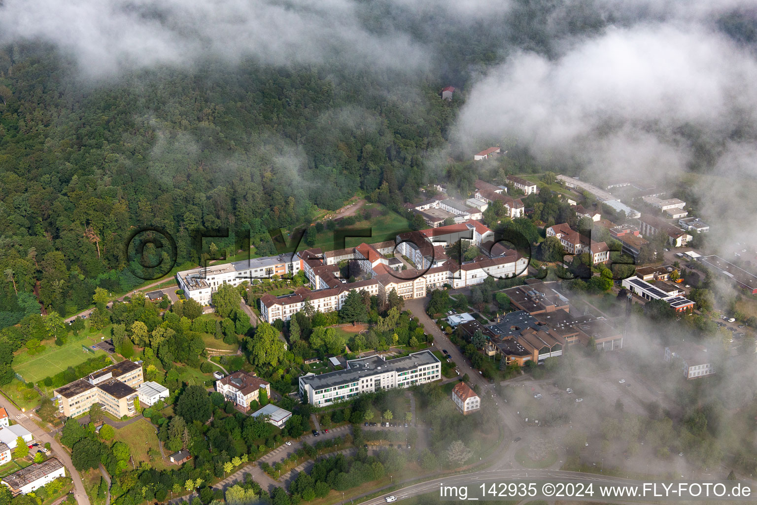 Thick clouds over the Palatinate Hospital for Psychiatry and Neurology in Klingenmünster in the state Rhineland-Palatinate, Germany from above