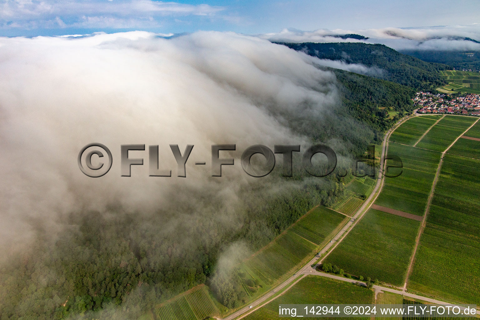 Aerial view of Dense clouds from the west flow over the Haardt edge below the Madenburg in Eschbach in the state Rhineland-Palatinate, Germany