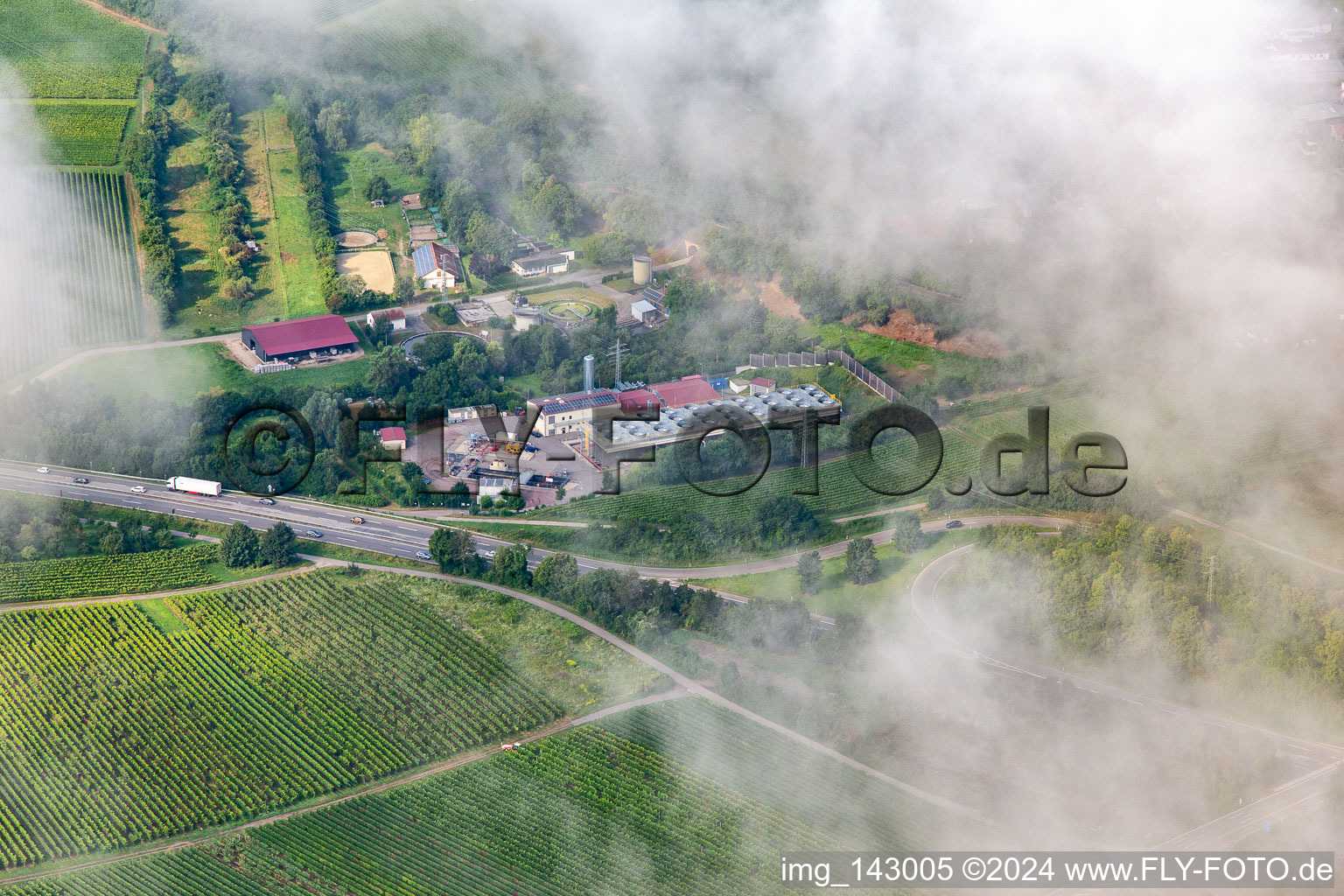 Aerial view of Low clouds over the geothermal power plant Insheim in Insheim in the state Rhineland-Palatinate, Germany