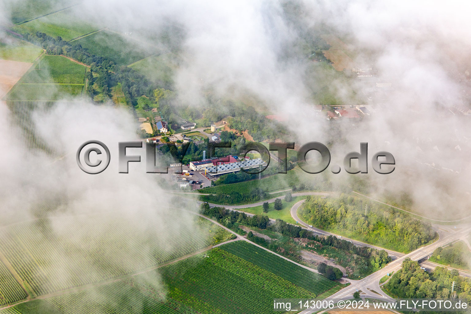 Aerial photograpy of Low clouds over the geothermal power plant Insheim in Insheim in the state Rhineland-Palatinate, Germany