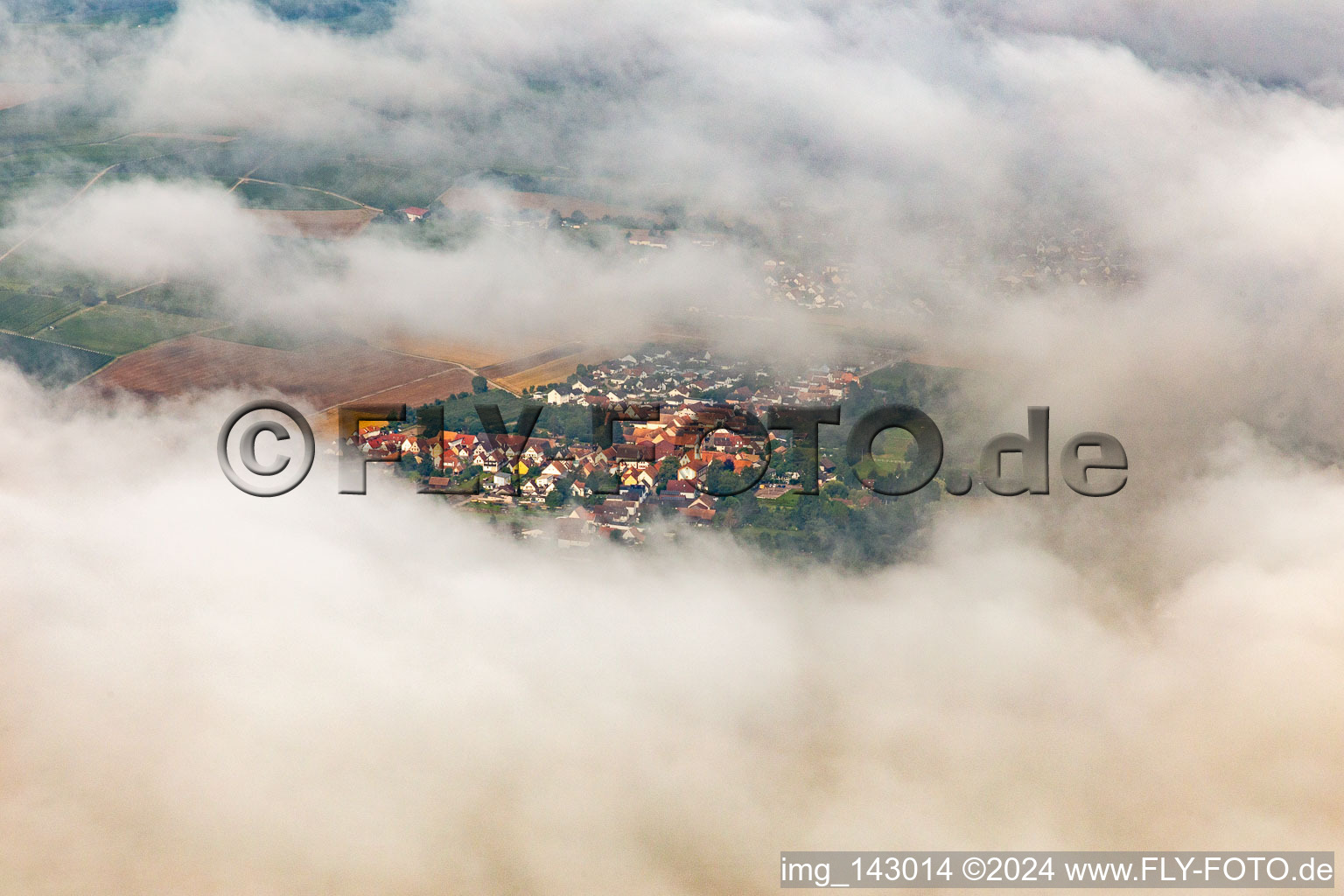 Village hidden under clouds from the east in the district Billigheim in Billigheim-Ingenheim in the state Rhineland-Palatinate, Germany