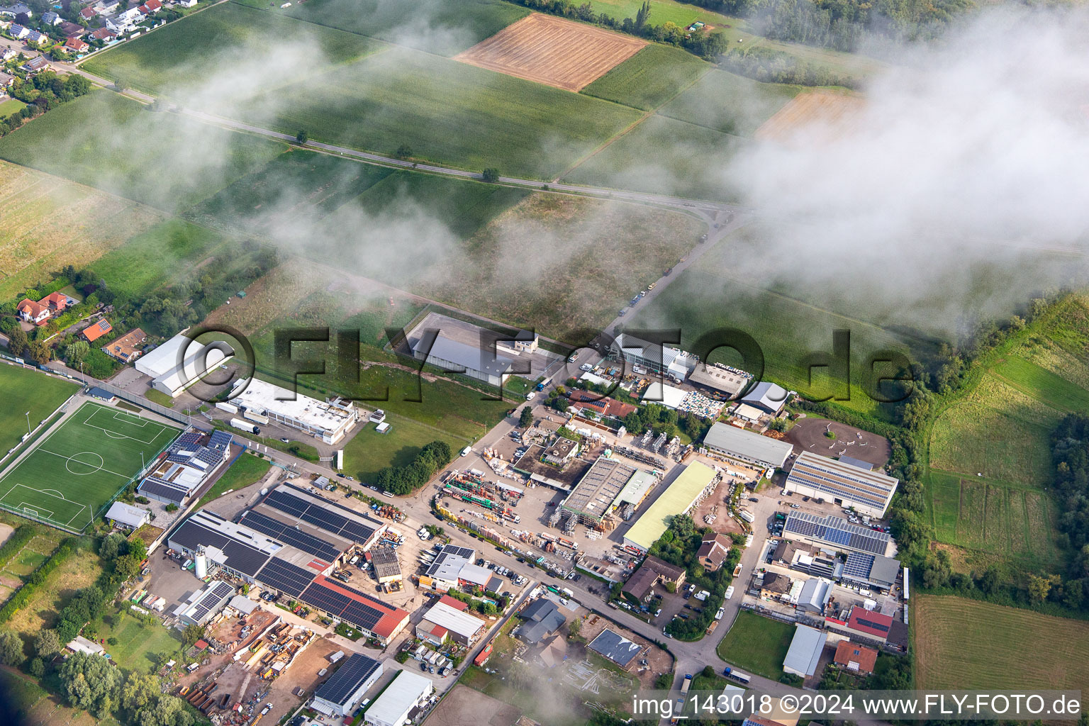 Industrial area Industriestrasse under clouds in the district Billigheim in Billigheim-Ingenheim in the state Rhineland-Palatinate, Germany