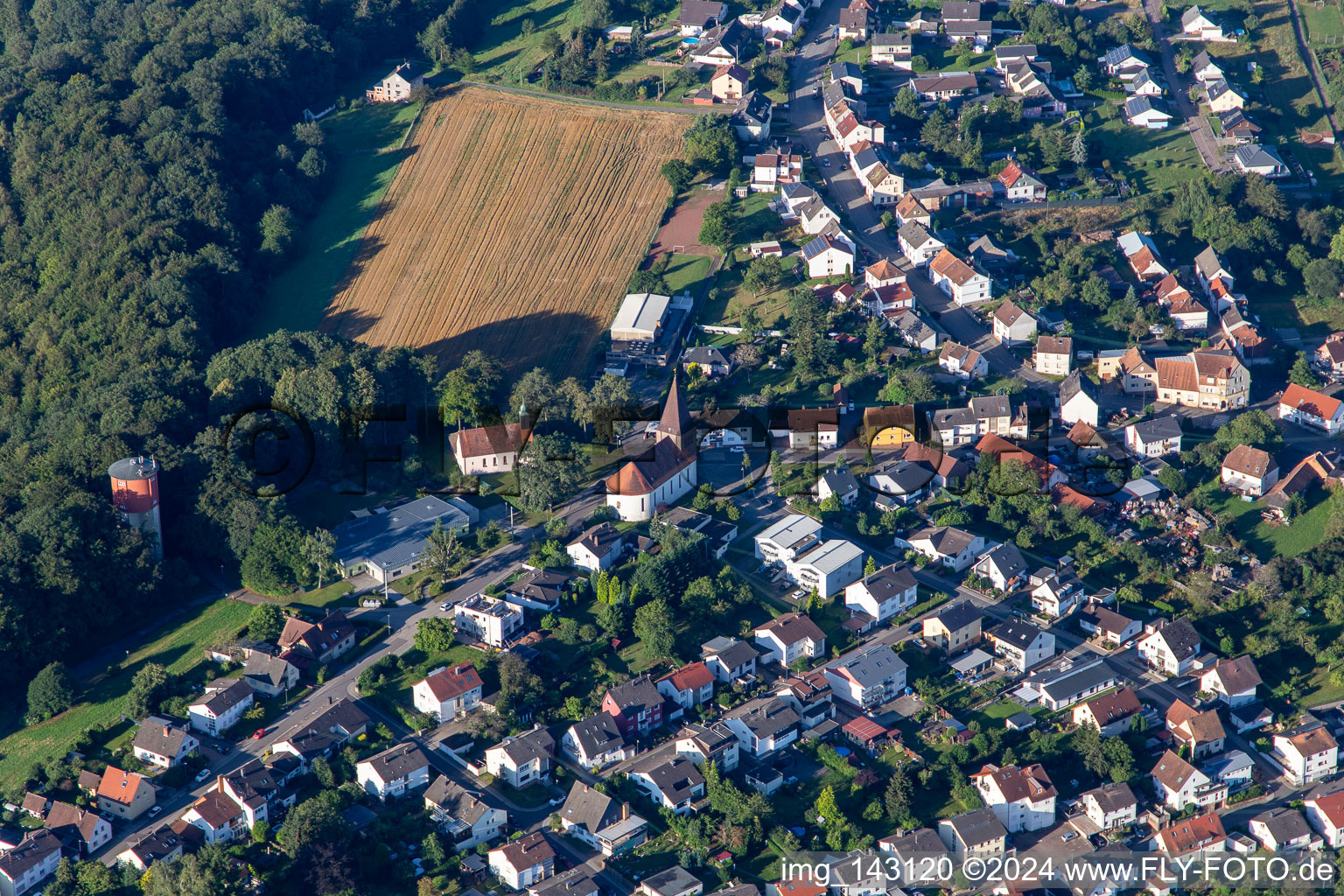 St. Joseph and water tower in the district Erlenbrunn in Pirmasens in the state Rhineland-Palatinate, Germany