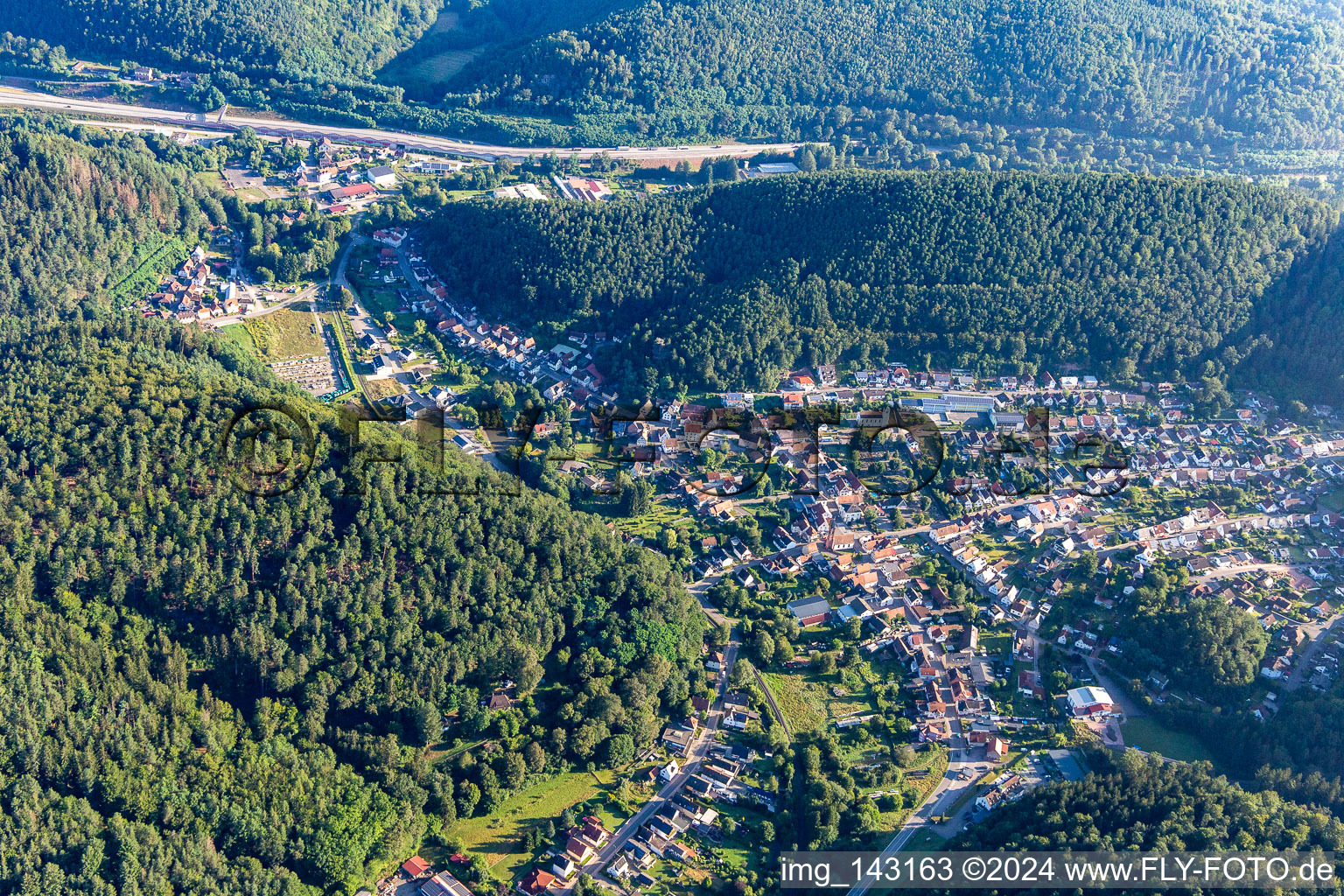 Aerial view of Place between mountains from south in Hinterweidenthal in the state Rhineland-Palatinate, Germany