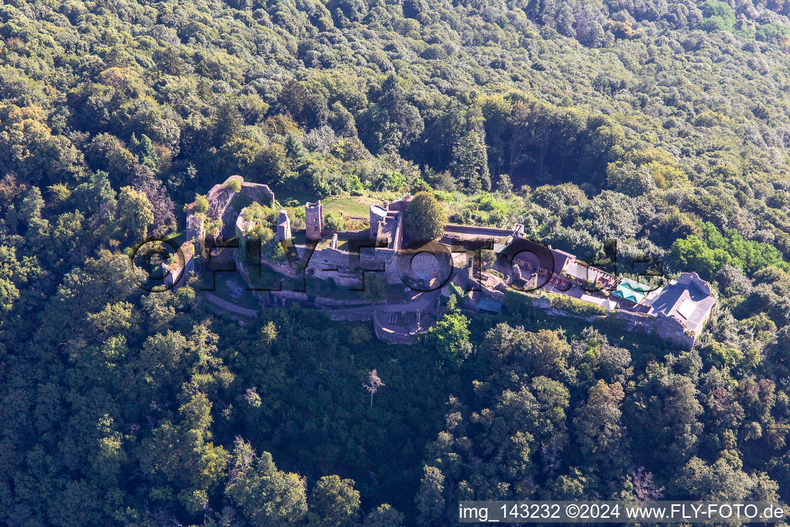 Aerial view of Madenburg, Remains of an 11th century hilltop castle surrounded by forests with restaurant from the west in Eschbach in the state Rhineland-Palatinate, Germany