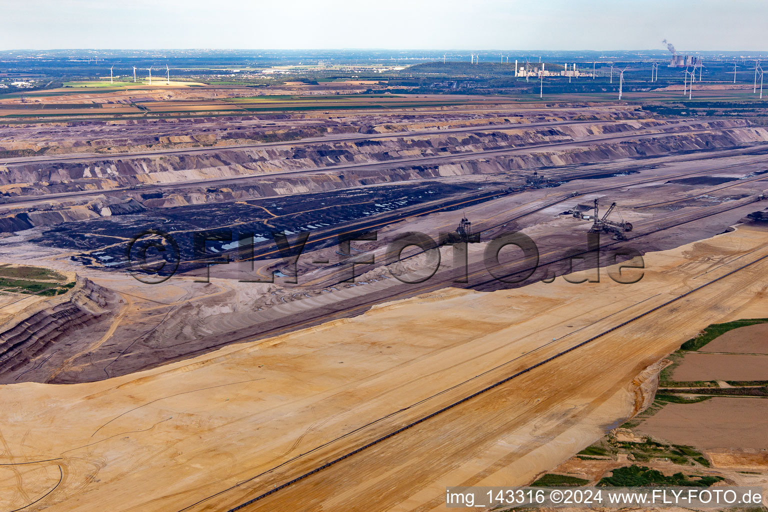 Aerial view of View of the Garzweiler open-cast lignite mine from the west in the district Keyenberg in Erkelenz in the state North Rhine-Westphalia, Germany