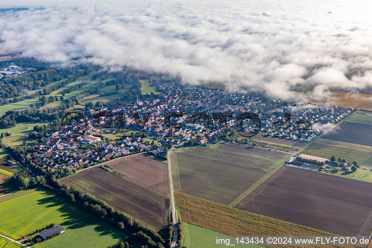 Village on the edge of the clouds in Steinweiler in the state Rhineland-Palatinate, Germany