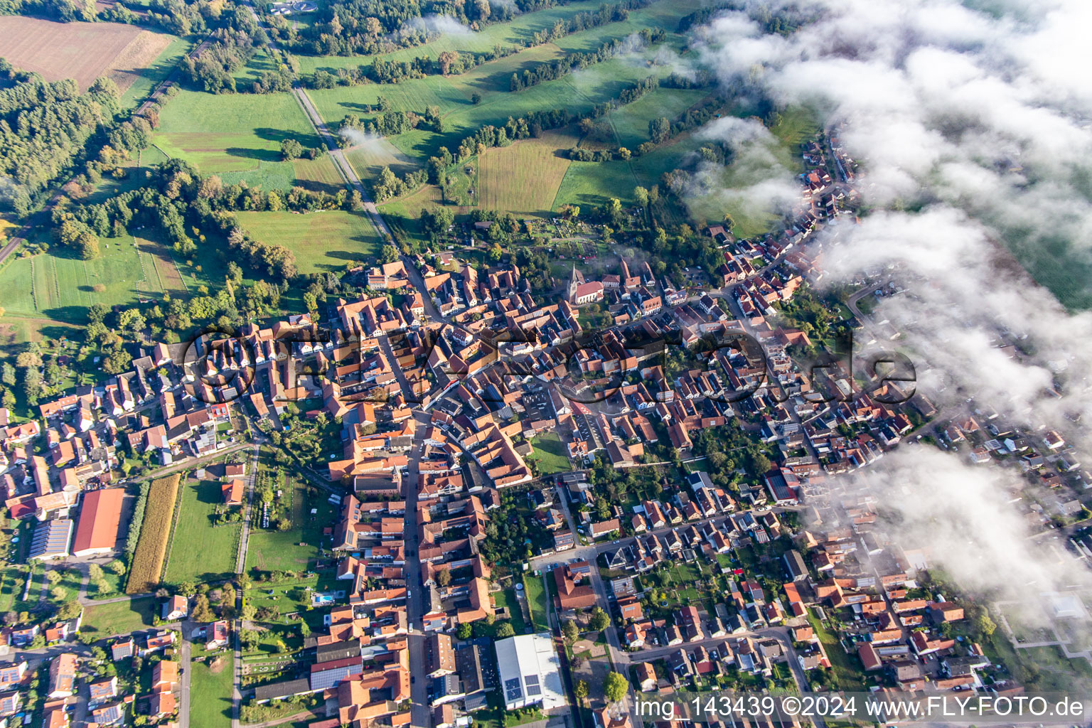 Aerial view of Village on the edge of the clouds in Steinweiler in the state Rhineland-Palatinate, Germany
