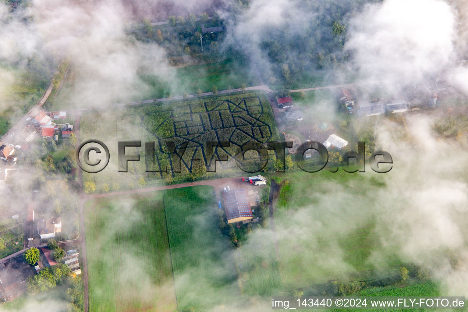 Seehof corn maze under low clouds in Steinweiler in the state Rhineland-Palatinate, Germany
