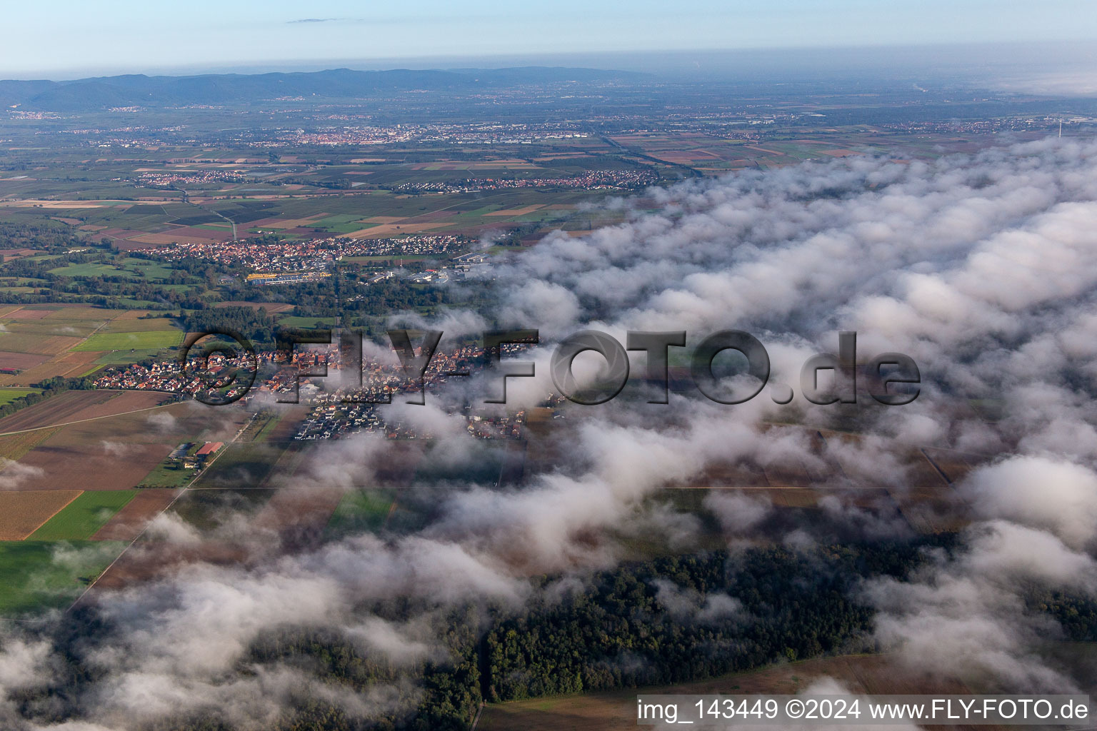 Village at the edge of the clouds from the south in Steinweiler in the state Rhineland-Palatinate, Germany