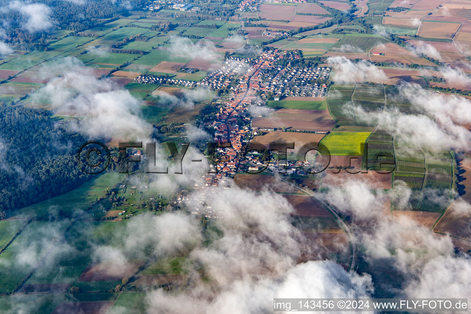 Aerial view of Village with clouds from the east in Freckenfeld in the state Rhineland-Palatinate, Germany