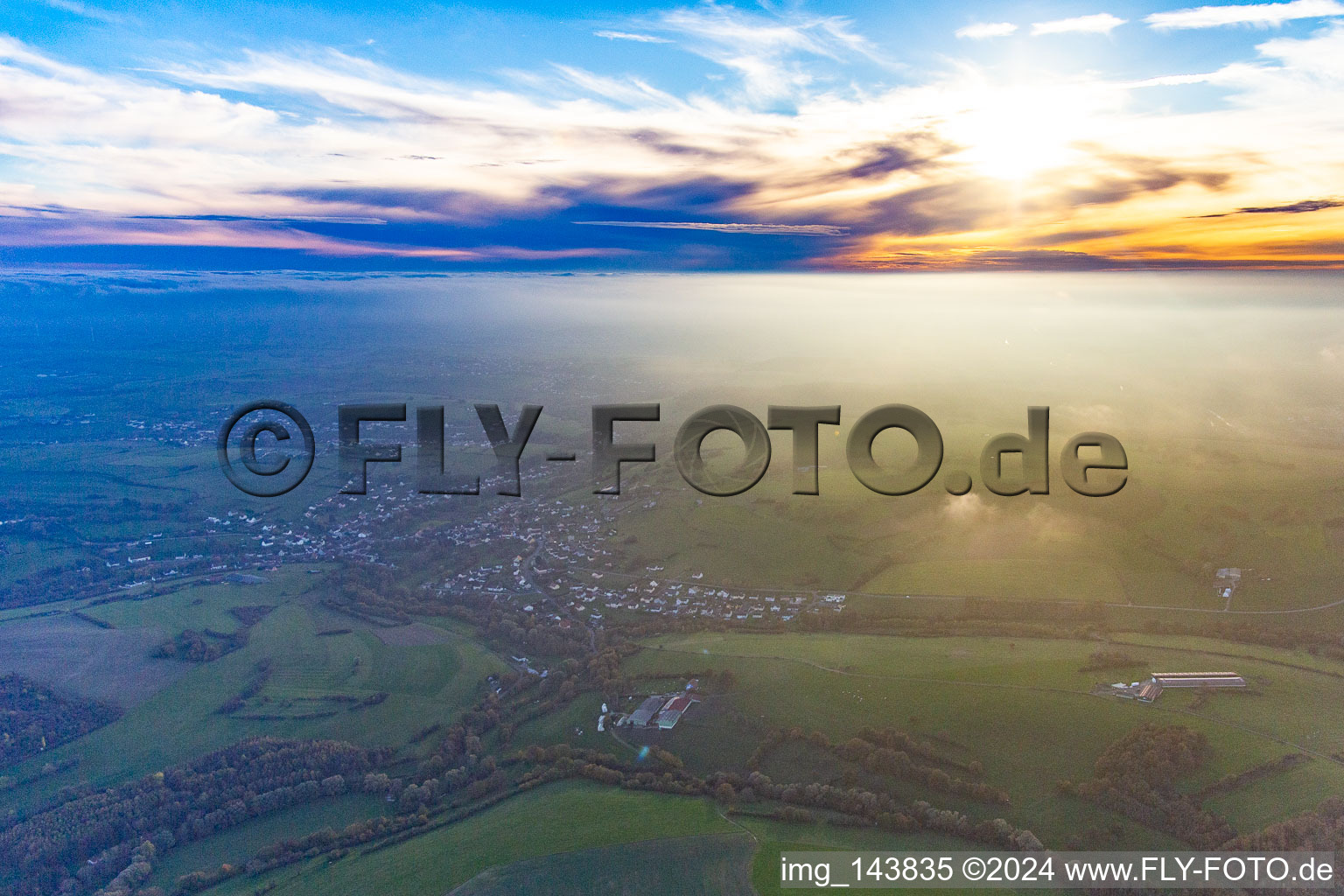 Village in the evening haze in Achen in the state Moselle, France