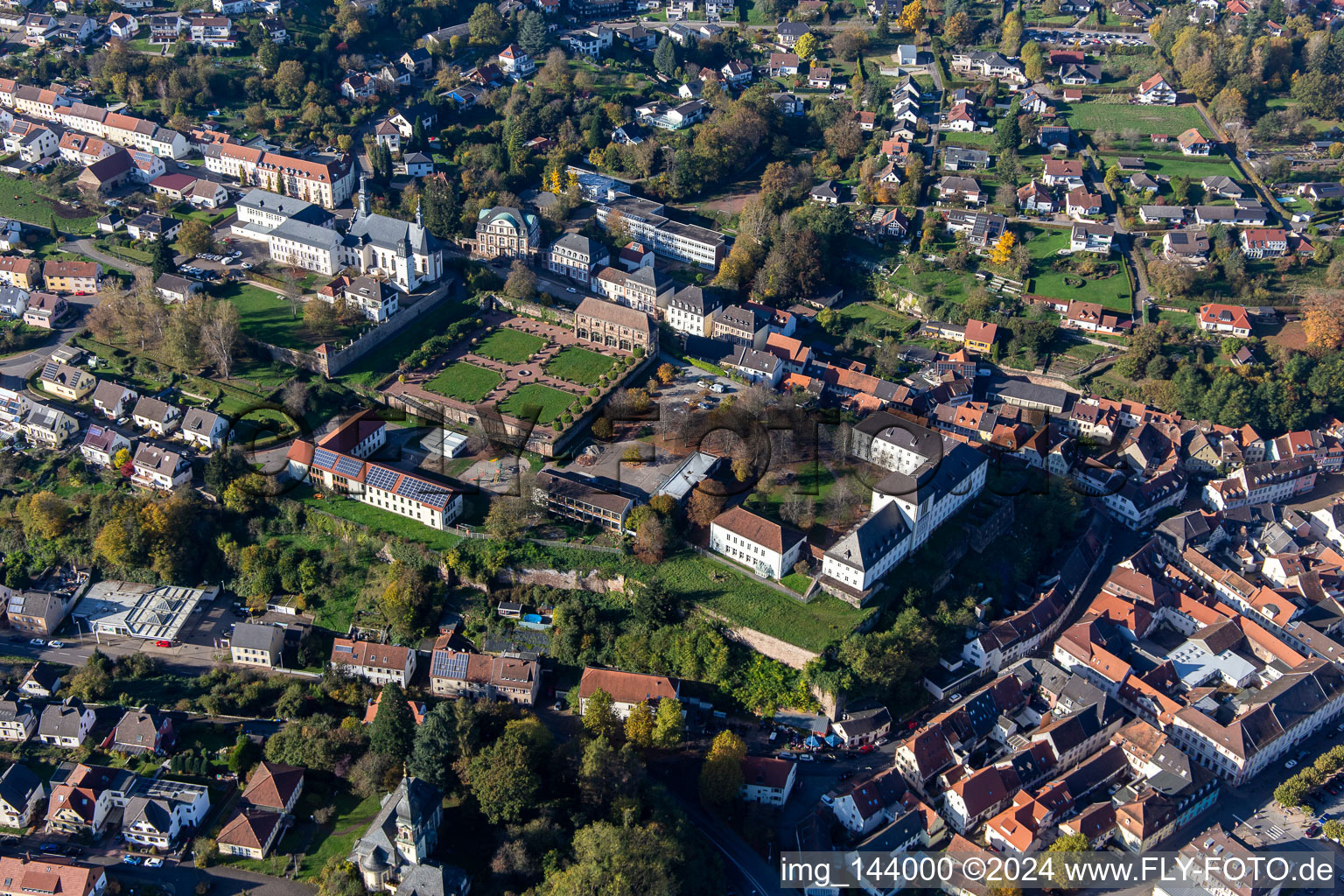 St. Anna and St. Philipp (castle church), orangery and baroque castle above the city in Blieskastel in the state Saarland, Germany out of the air