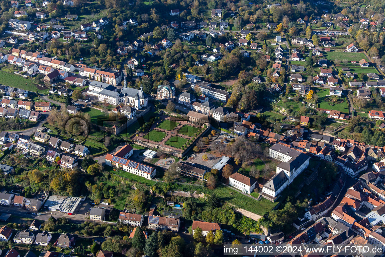 St. Anna and St. Philipp (castle church), orangery and baroque castle above the city in Blieskastel in the state Saarland, Germany seen from above