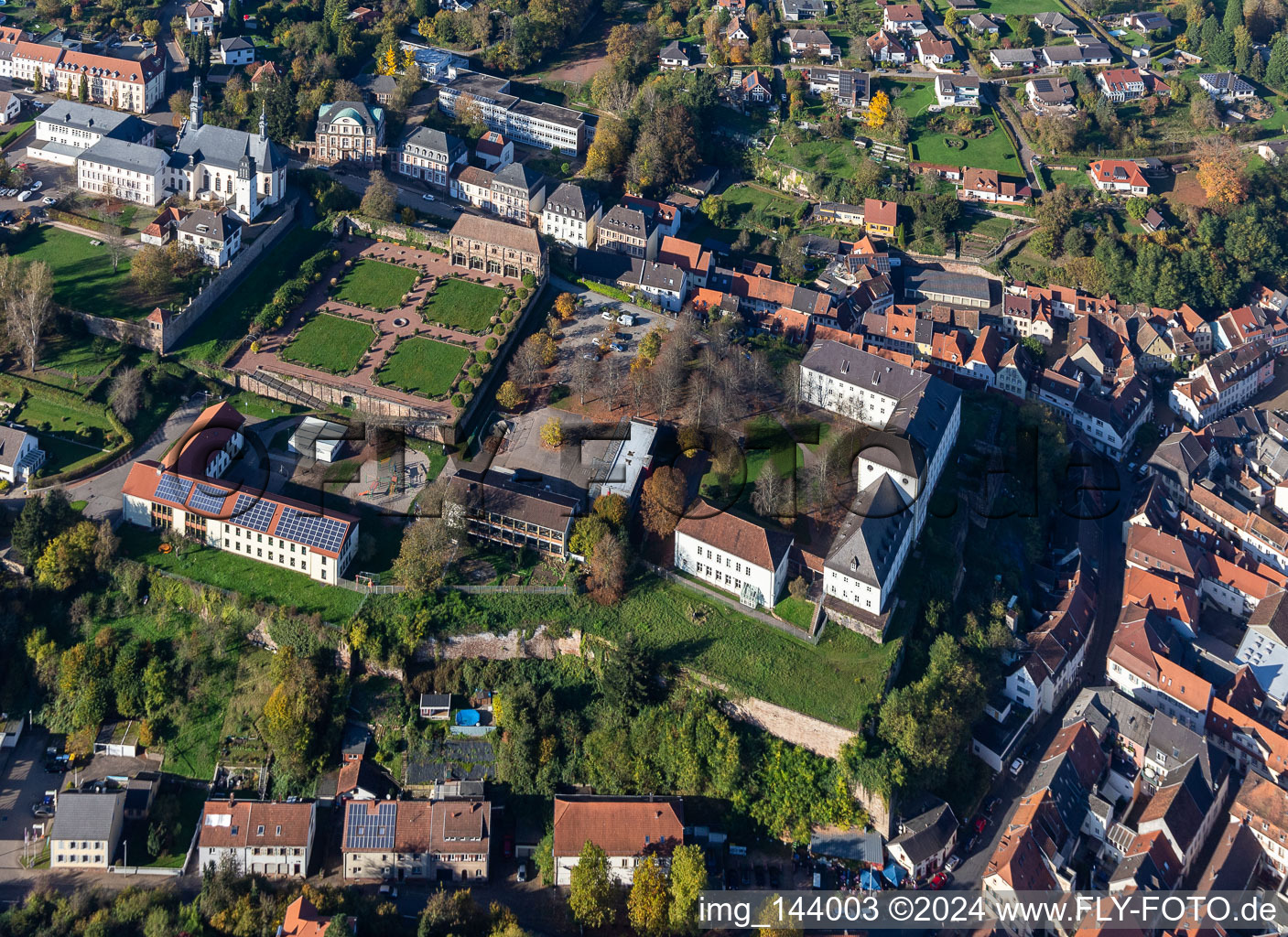 St. Anna and St. Philipp (castle church), orangery and baroque castle above the city in Blieskastel in the state Saarland, Germany from the plane