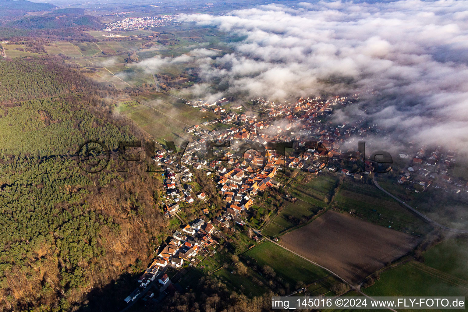 Aerial view of Village on the edge of the clouds in Oberotterbach in the state Rhineland-Palatinate, Germany