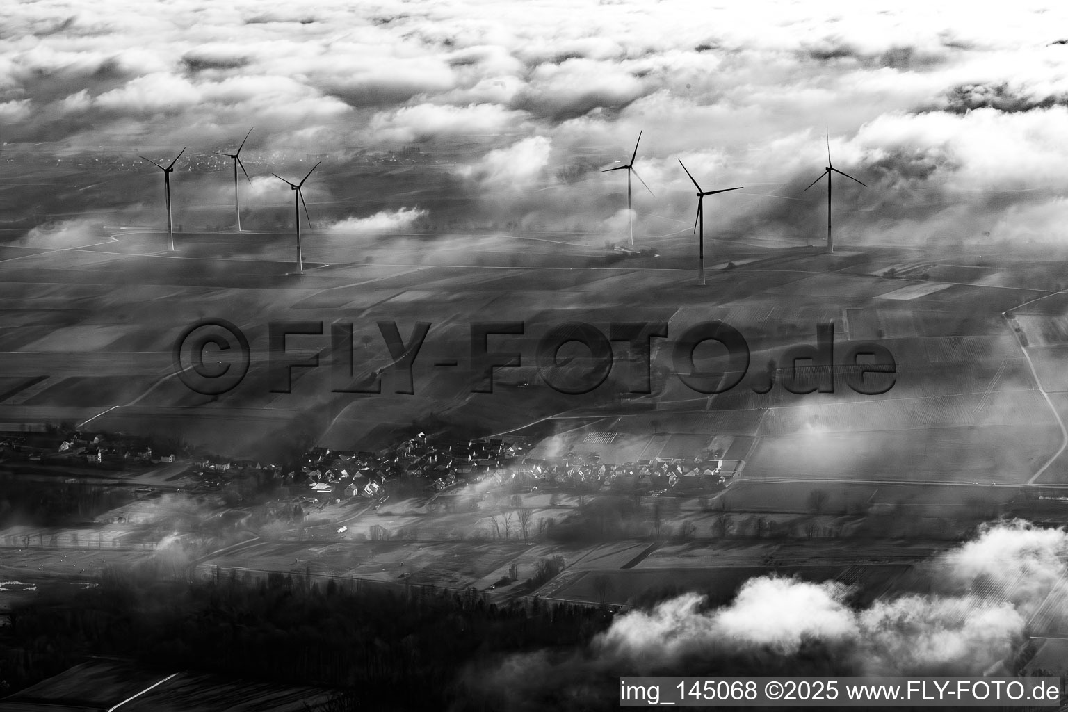 Freckenfeld wind farm at the edge of the clouds in Hergersweiler in the state Rhineland-Palatinate, Germany