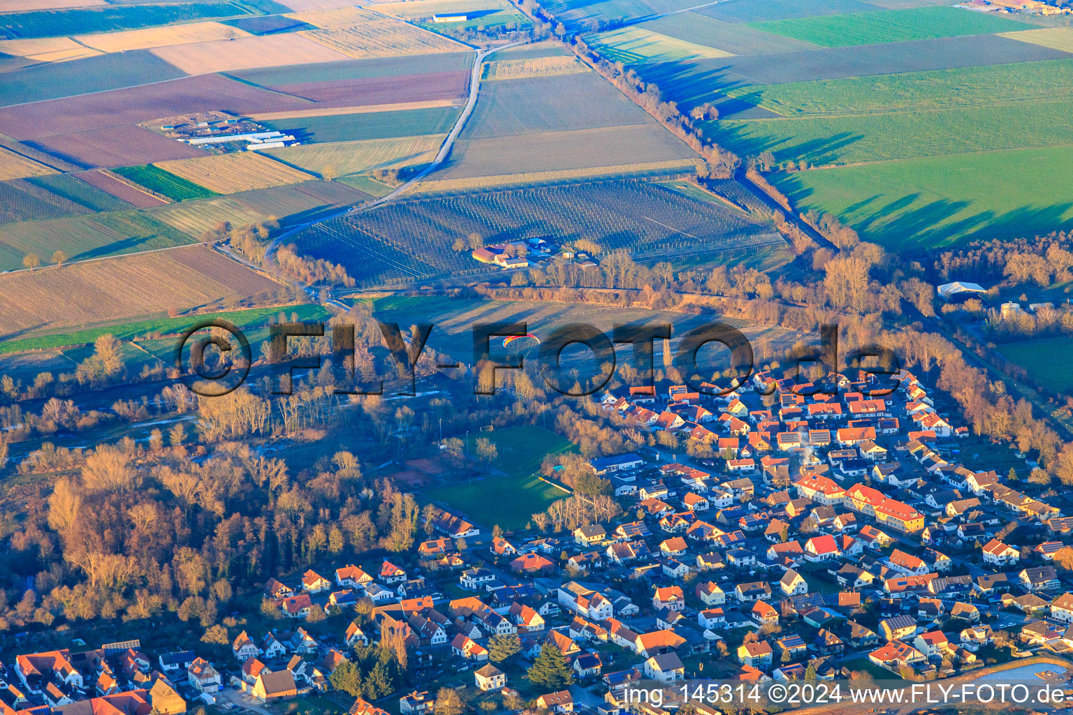 Paragliders over the town in Winden in the state Rhineland-Palatinate, Germany