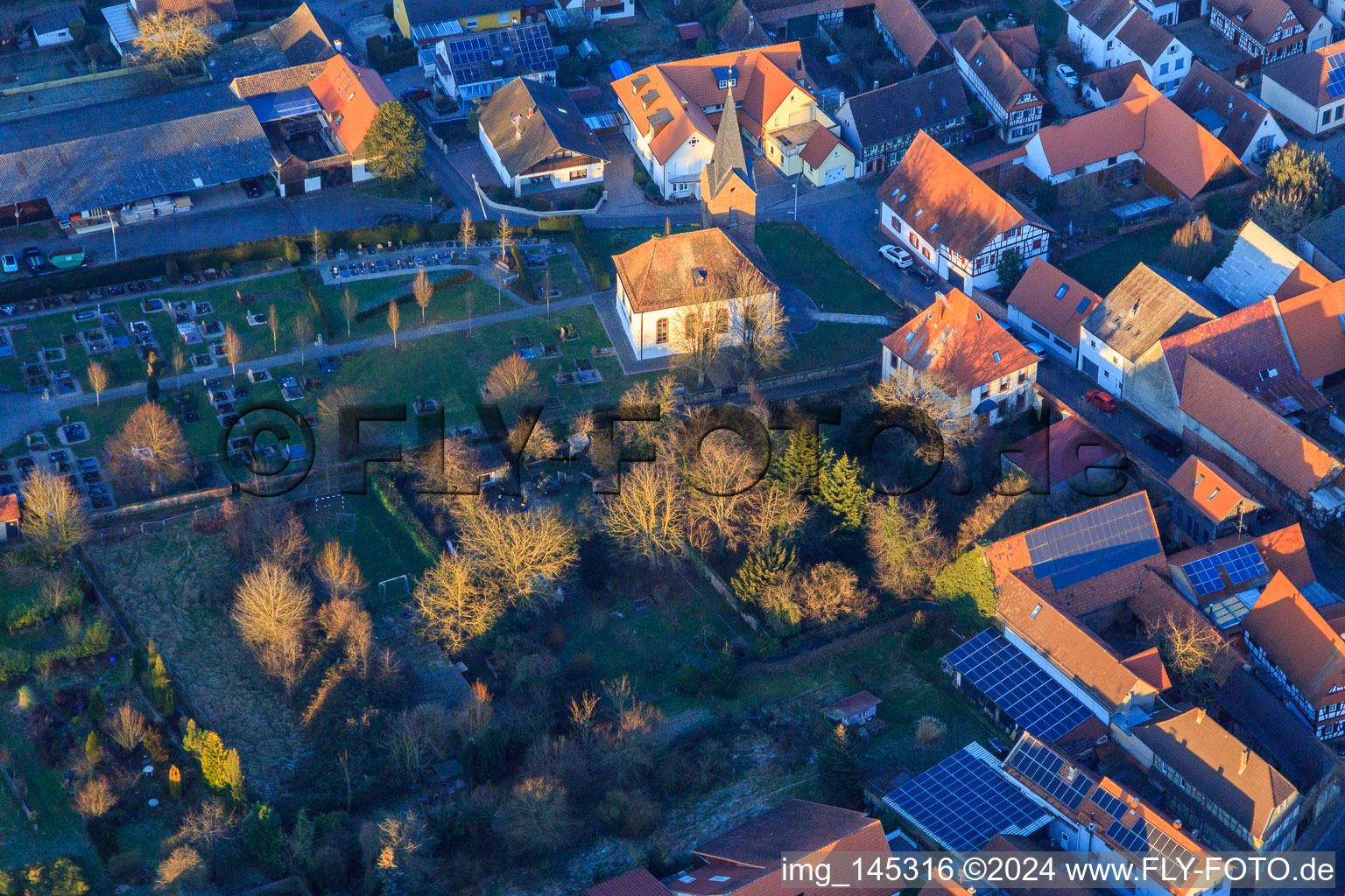 Protest. Church and cemetery on a winter evening in Winden in the state Rhineland-Palatinate, Germany
