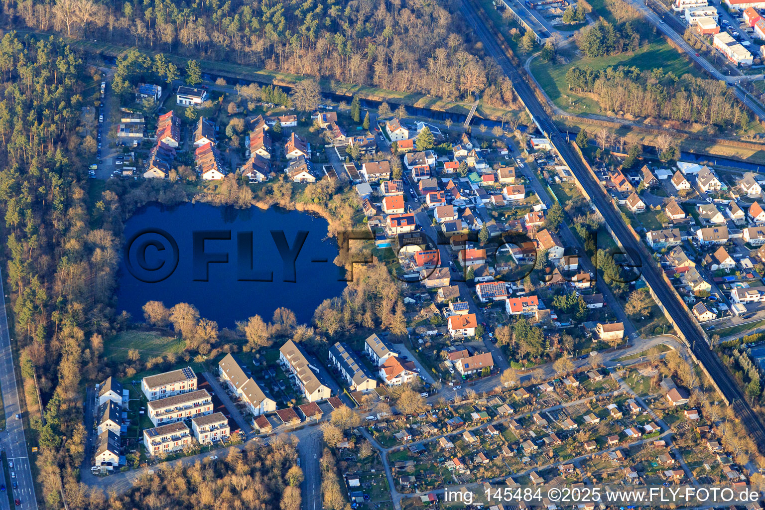 Lachenweg, sandy path by the lake in the district Hagsfeld in Karlsruhe in the state Baden-Wuerttemberg, Germany