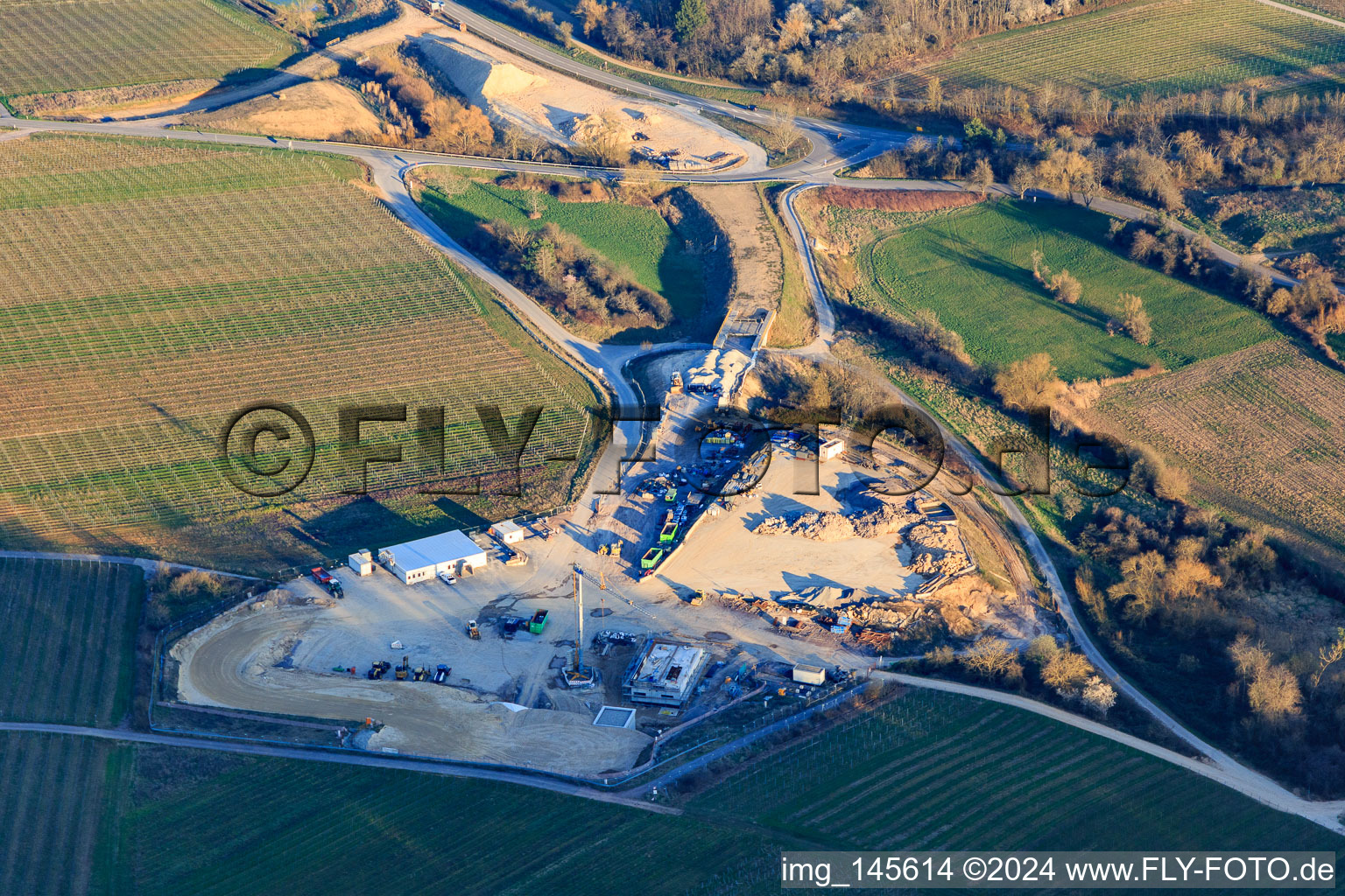 Construction site of the eastern tunnel portal for the Astrid Tunnel for the underpass and bypass of Bad Bergzabern between B38 (Weinstraße) and B427 (Kurtalstraße) in Dörrenbach in the state Rhineland-Palatinate, Germany seen from a drone