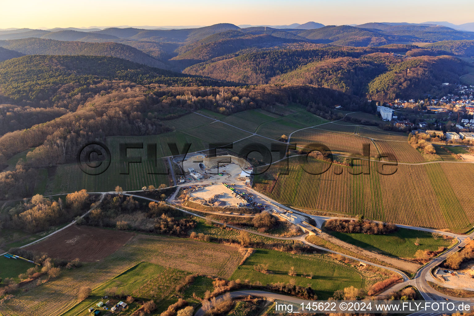 Construction site of the eastern tunnel portal for the Astrid Tunnel for the underpass and bypass of Bad Bergzabern between B38 (Weinstraße) and B427 (Kurtalstraße) in Dörrenbach in the state Rhineland-Palatinate, Germany seen from above