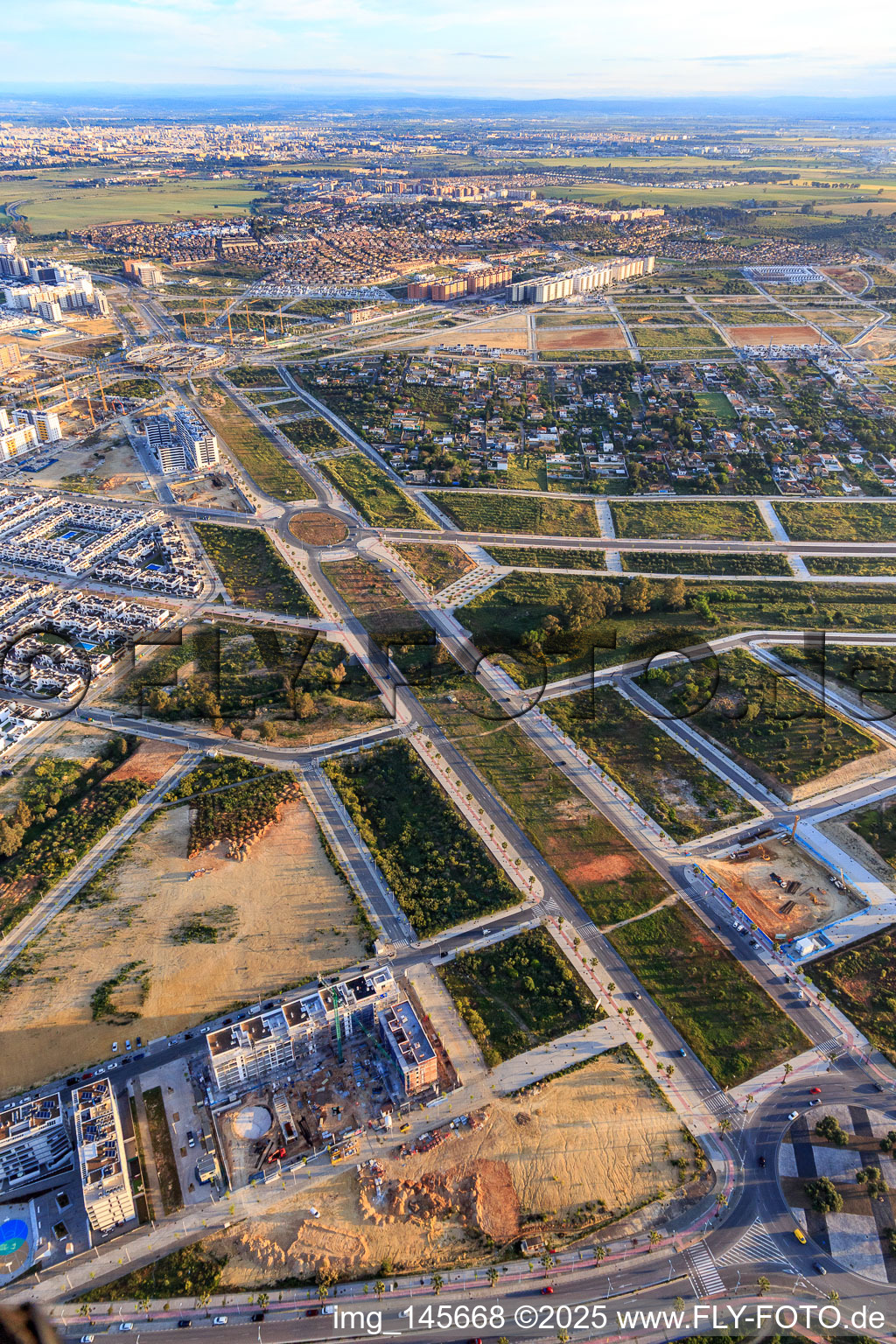 Aerial view of Development of new residential and commercial areas along Av. Rafael Escuredo Rodríguez and Menasalbas Park in Dos Hermanas in the state Seville, Spain