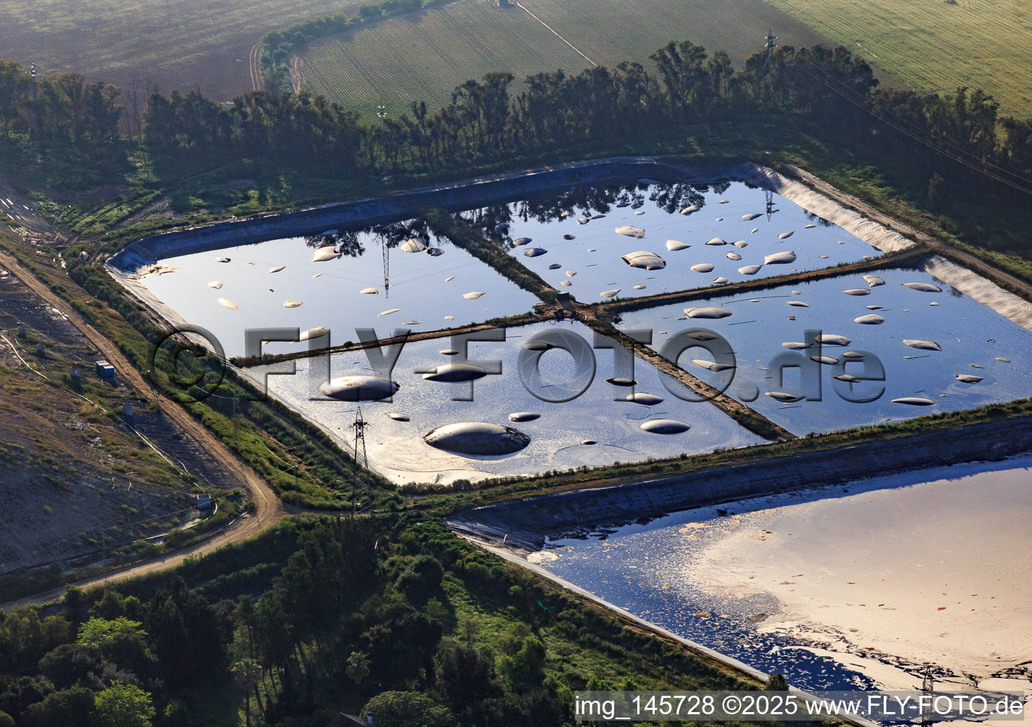 Sewage tank at the landfill with large fermentation gas bubbles in Utrera in the state Seville, Spain