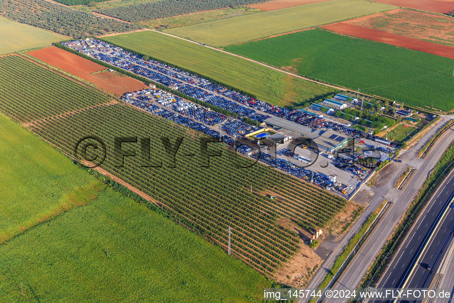 Rows of stacked old vehicles at the Desguace Siglo 21 scrapyard in Dos Hermanas in the state Seville, Spain