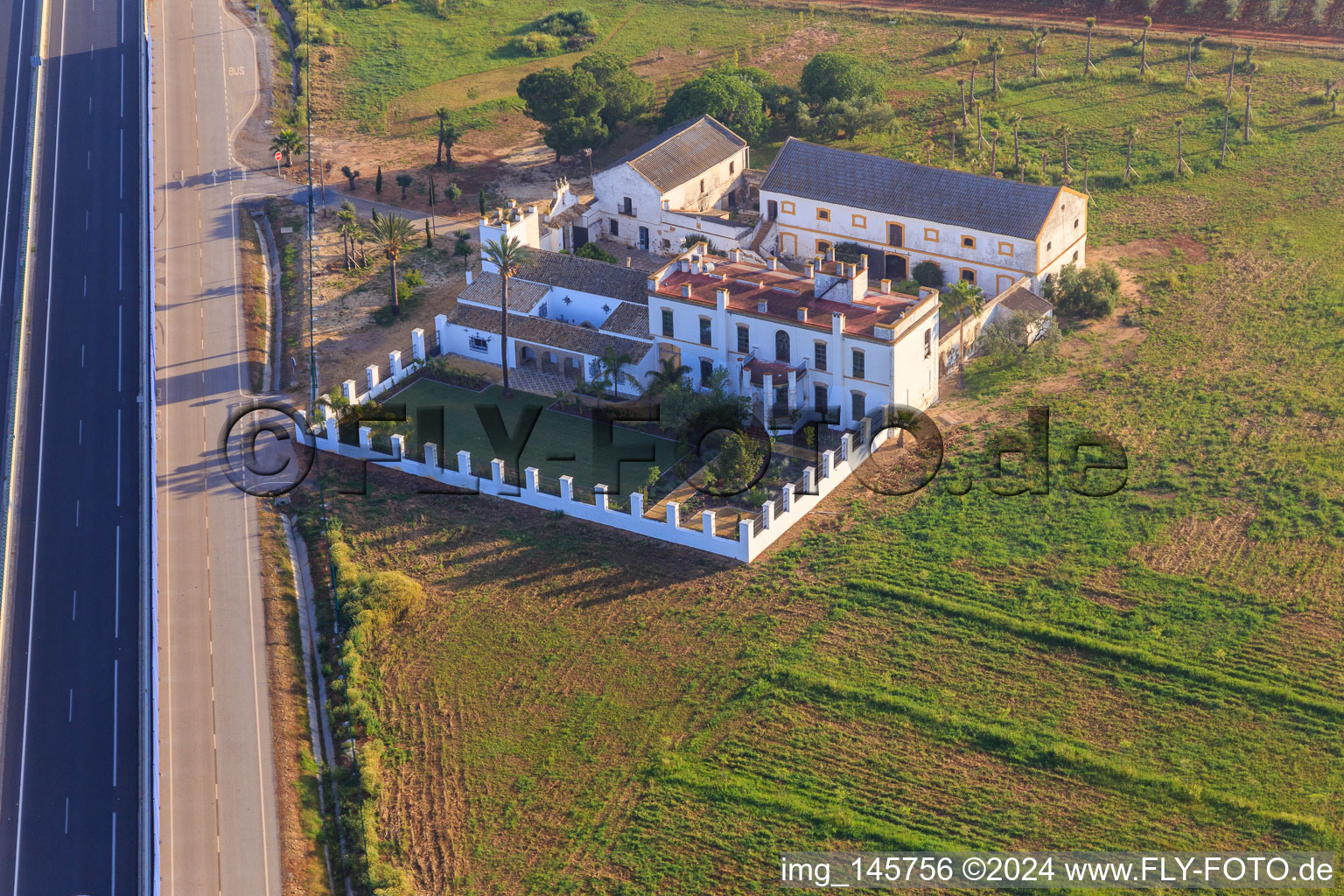 Aerial view of Hacienda Menaca between olive tree plantations on the A-4 Autovia del Sur in Dos Hermanas in the state Seville, Spain
