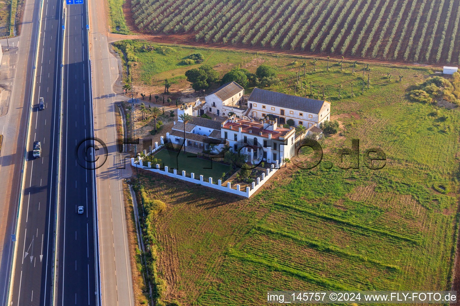 Aerial photograpy of Hacienda Menaca between olive tree plantations on the A-4 Autovia del Sur in Dos Hermanas in the state Seville, Spain