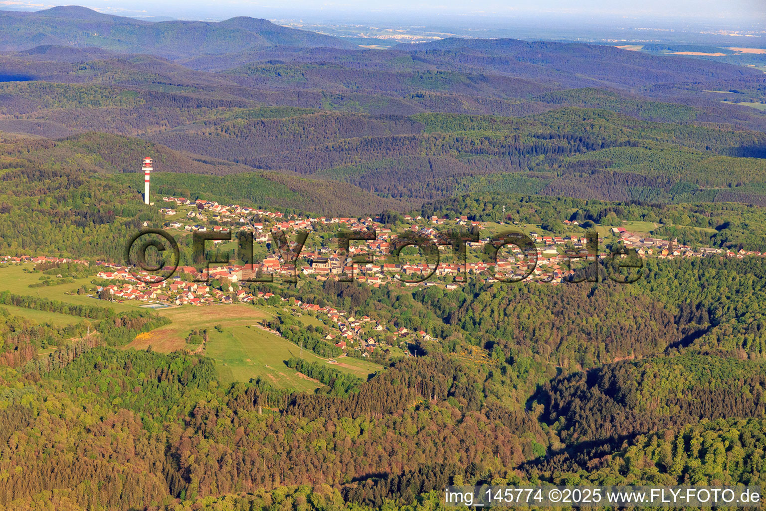 View of the town next to the radio tower Tour hertzienne de Goetzenbruck in the Northern Vosges from the west in Goetzenbruck in the state Moselle, France