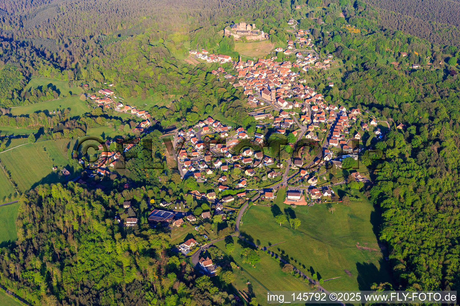 View of the village in the Northern Vosges from the west below the Château de Lichtenberg in Lichtenberg in the state Bas-Rhin, France