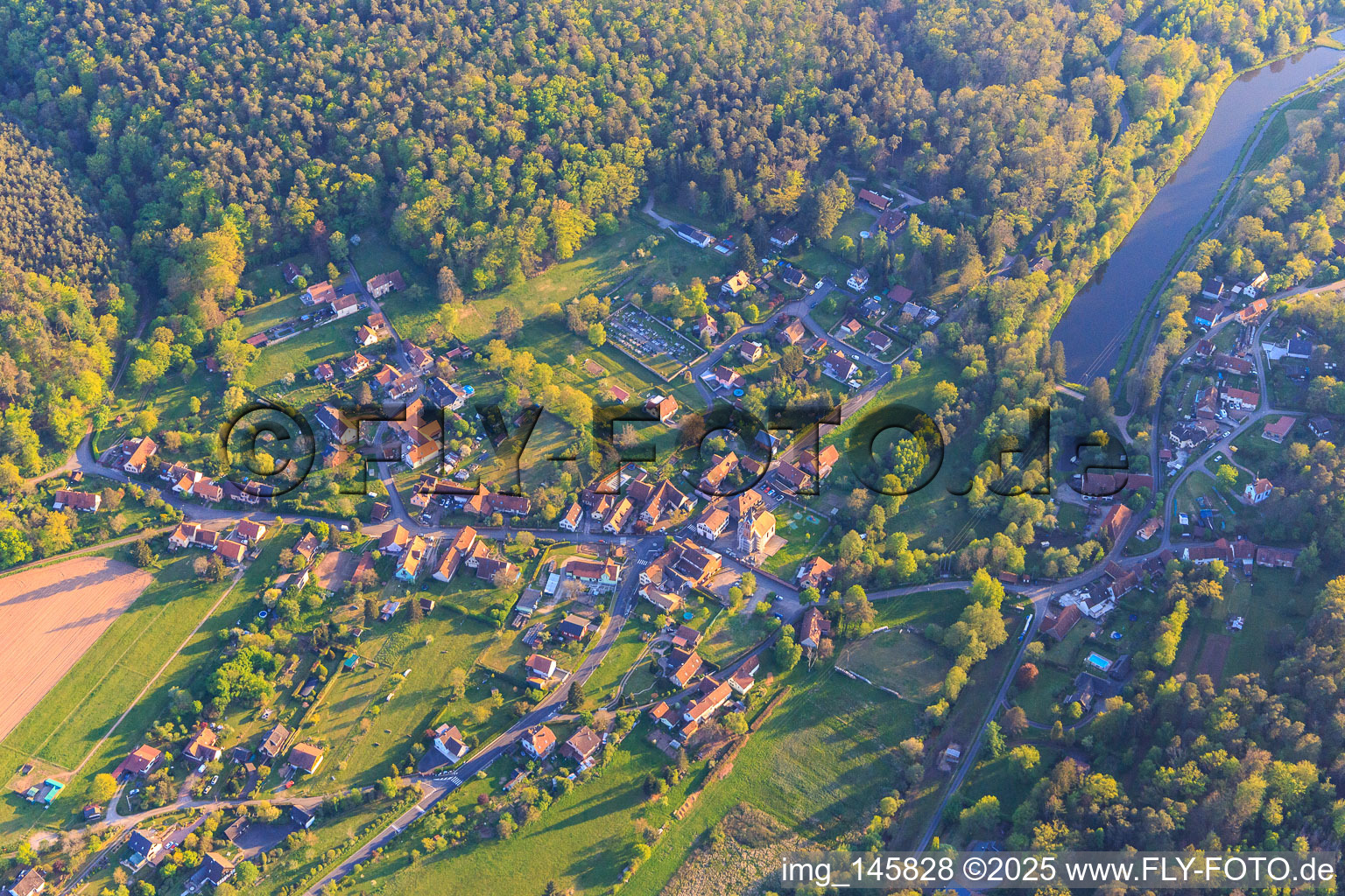 Village view with fish pond in the Meisenbach valley in the Northern Vosges from the northeast in Sparsbach in the state Bas-Rhin, France