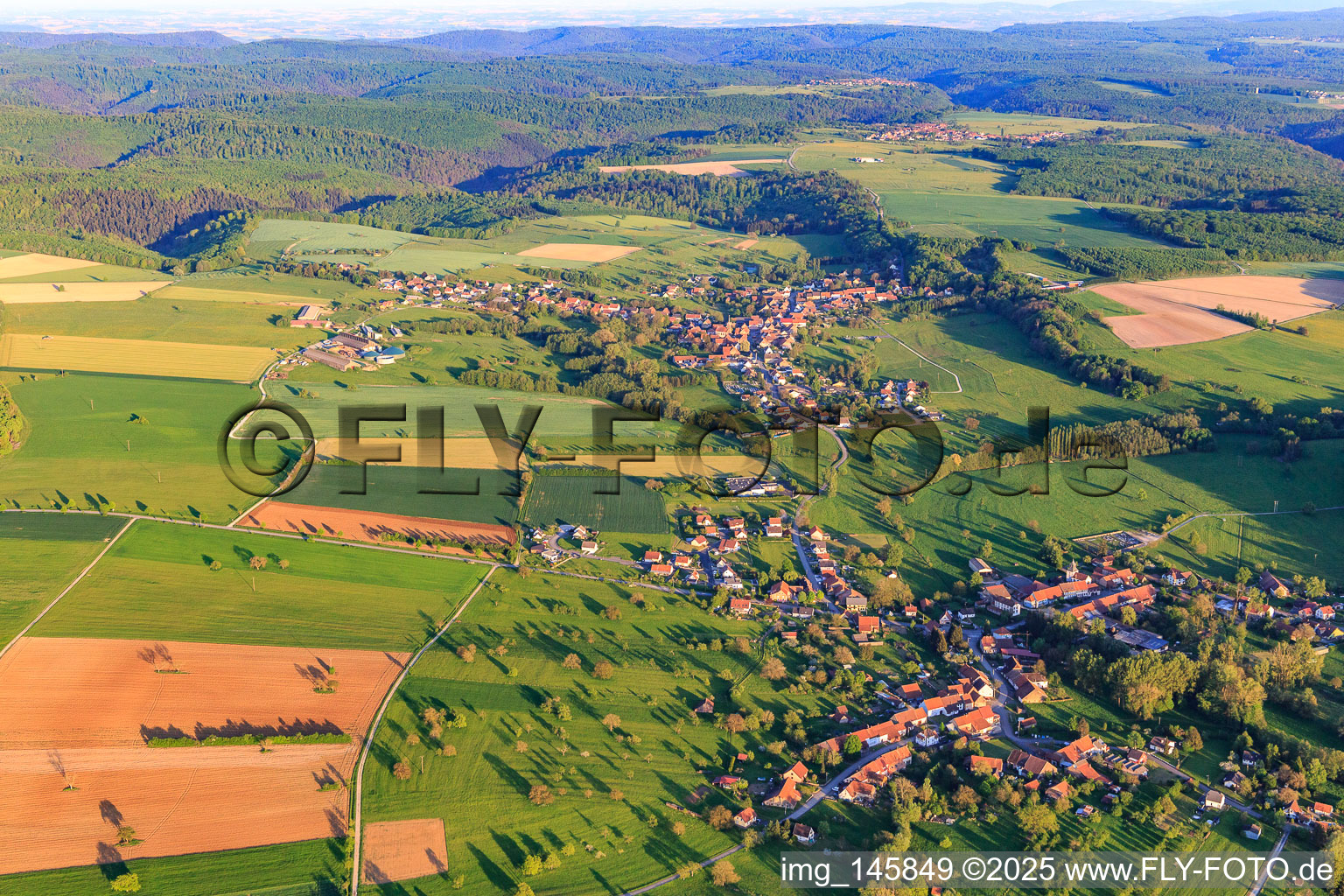 View of the village on the edge of the Northern Vosges from the northwest in Ottwiller in the state Bas-Rhin, France