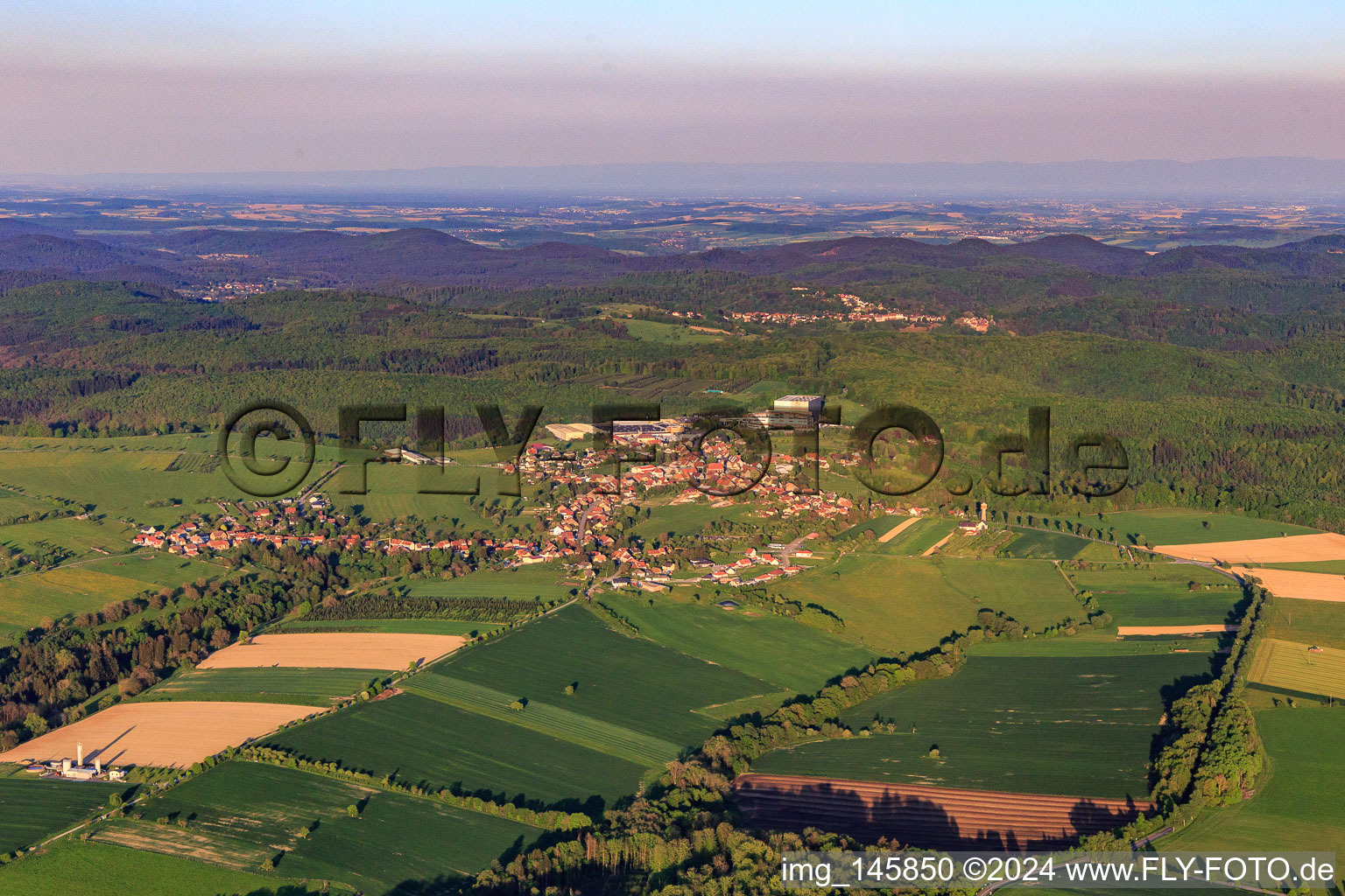 View of the town in the evening from the northwest in Petersbach in the state Bas-Rhin, France