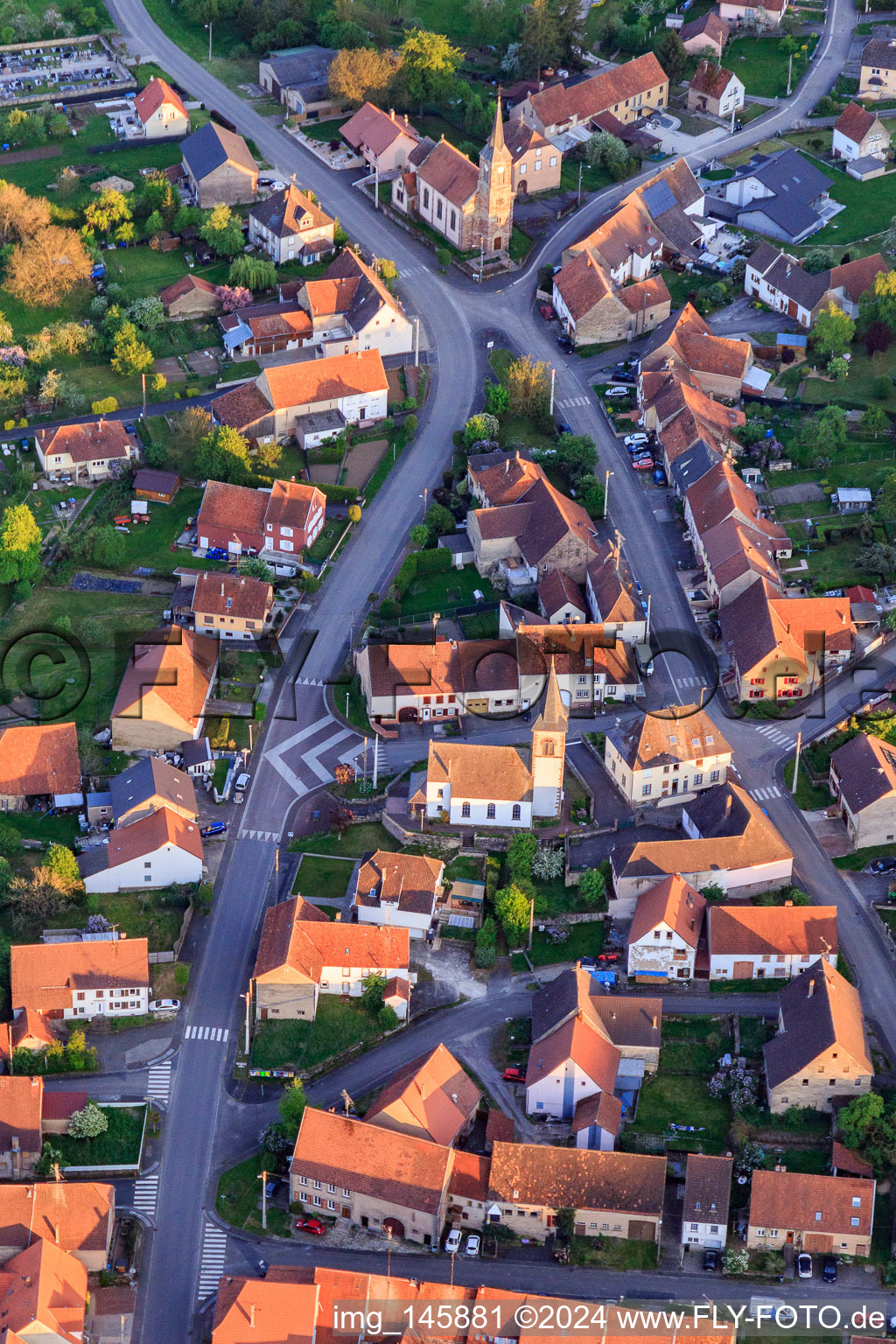 Two churches in the village center from the north in Vœllerdingen in the state Bas-Rhin, France