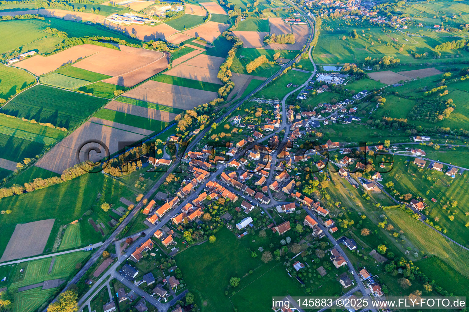 Village overview in the evening from the northwest in Vœllerdingen in the state Bas-Rhin, France