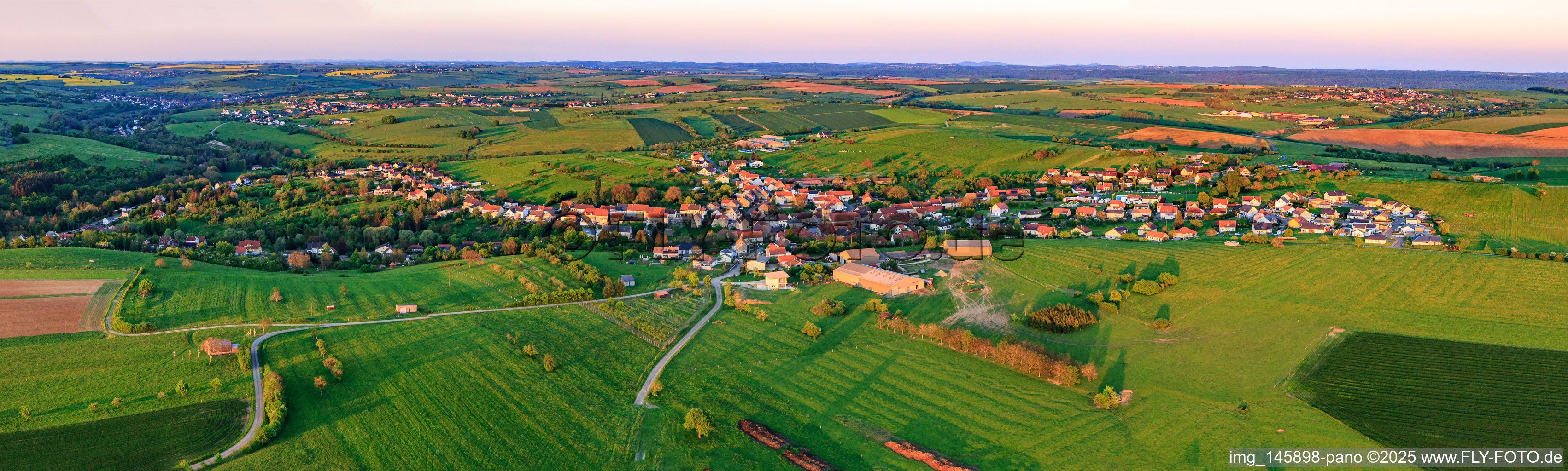Panorama of the town view from the west in the evening in Kalhausen in the state Moselle, France