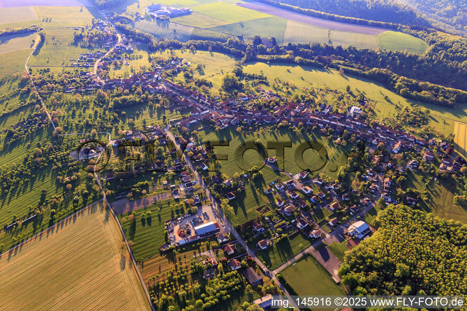 Village overview in the morning from the west in Weislingen in the state Bas-Rhin, France