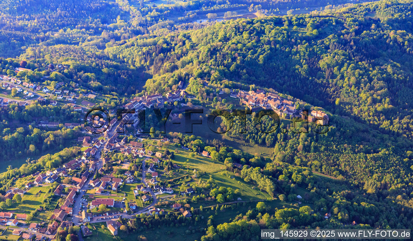 Aerial photograpy of View of the hilly Alsace region of the Northern Vosges with Lützelstein Castle / Château de La Petite-Pierre in the morning from the north in La Petite-Pierre in the state Bas-Rhin, France